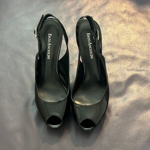 Black patent leather sling back. Size 6 1/2. Peep toe platform front.